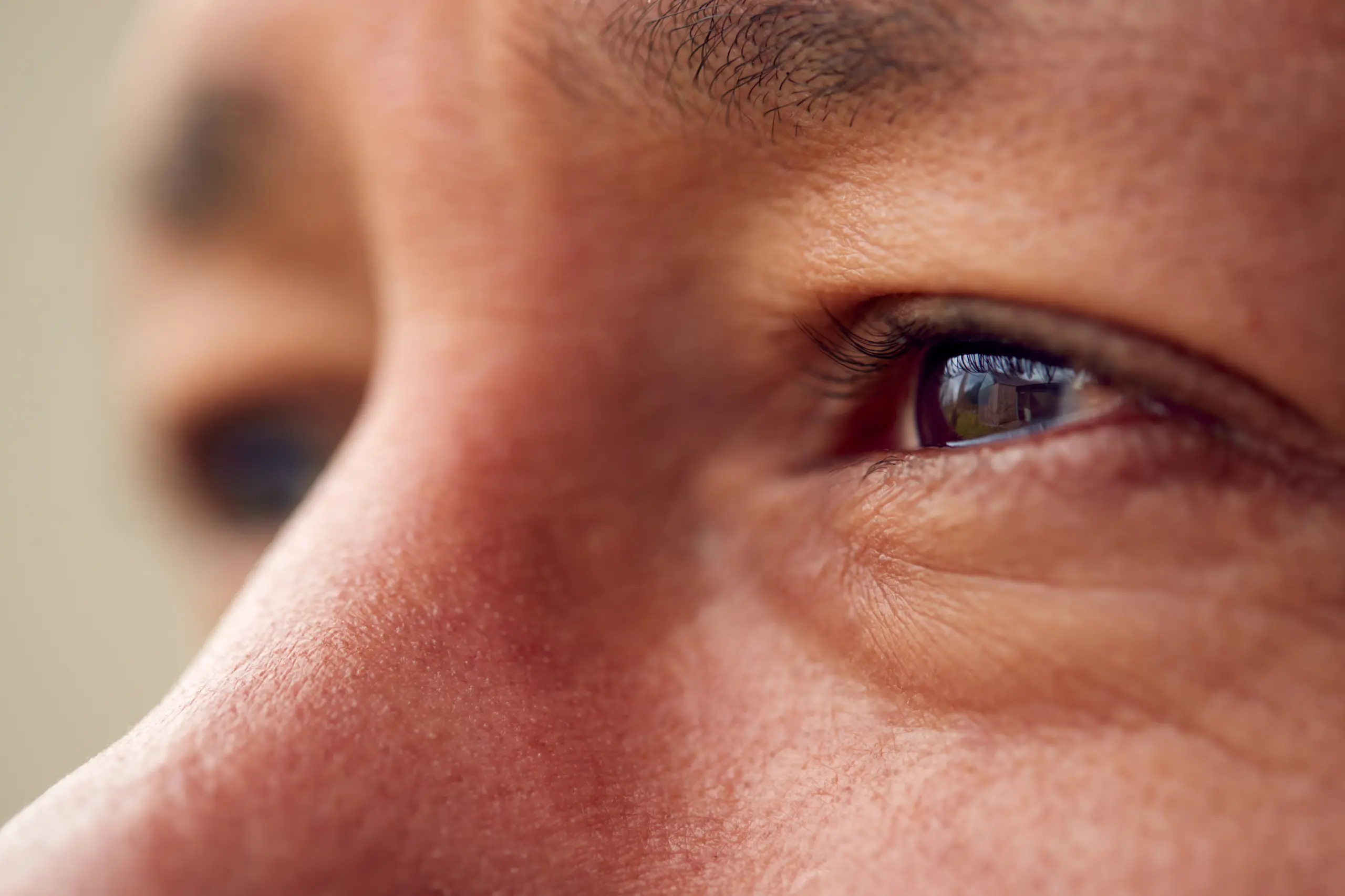 close up male eyes with ptosis
